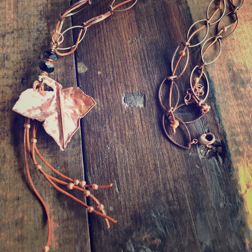 Hand wrought copper leaf with leather dangles